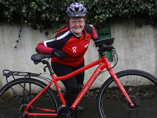 Sheila poses with her bike