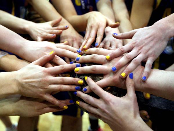 Team huddle with hands
