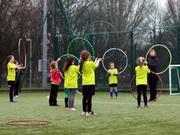 Children playing with Hoola Hoops 