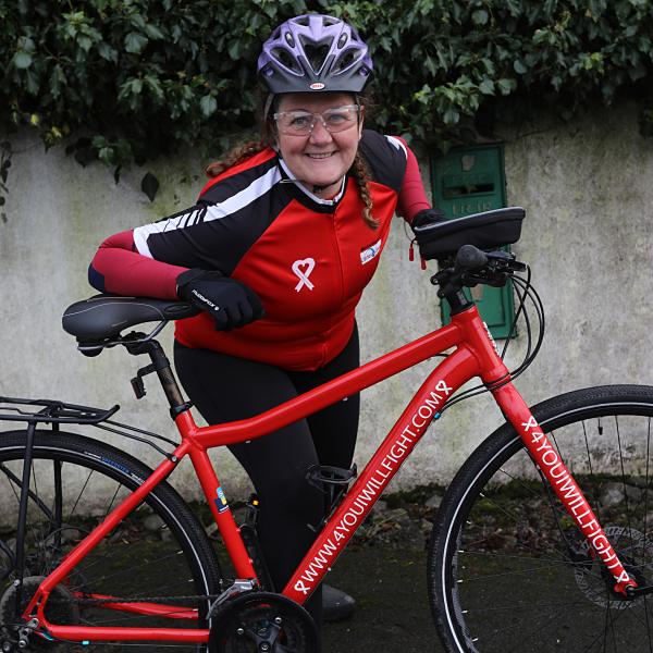 Sheila poses with her bike