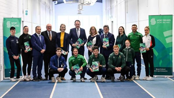 Ministers of Sport, Sport Ireland Representatives, and carded athletes holding up the 2026 High Performance Investment Brochure