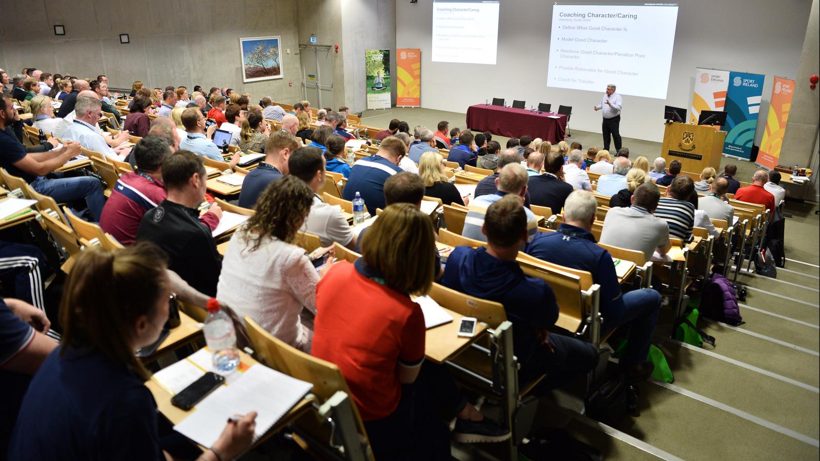 a group of coaches attending a lecture