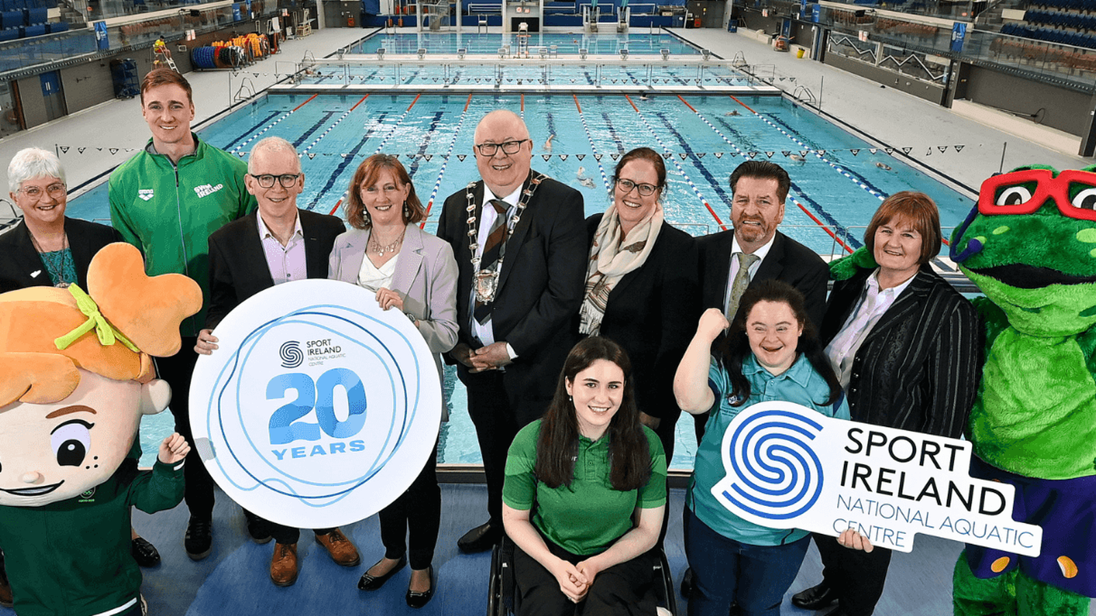 A group of people celebrating the 20th Anniversary of the National Aquatic Centre