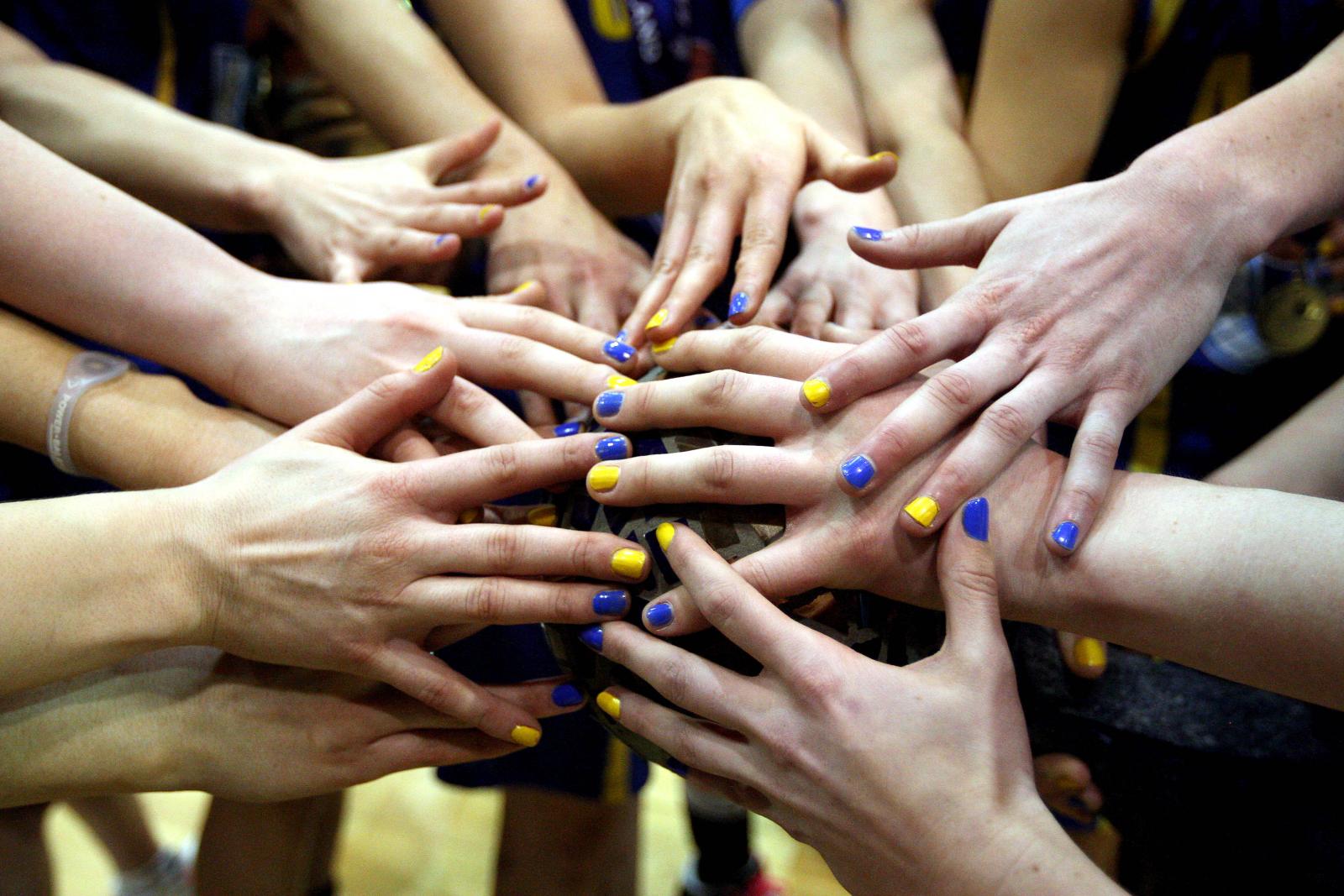 Team huddle with hands