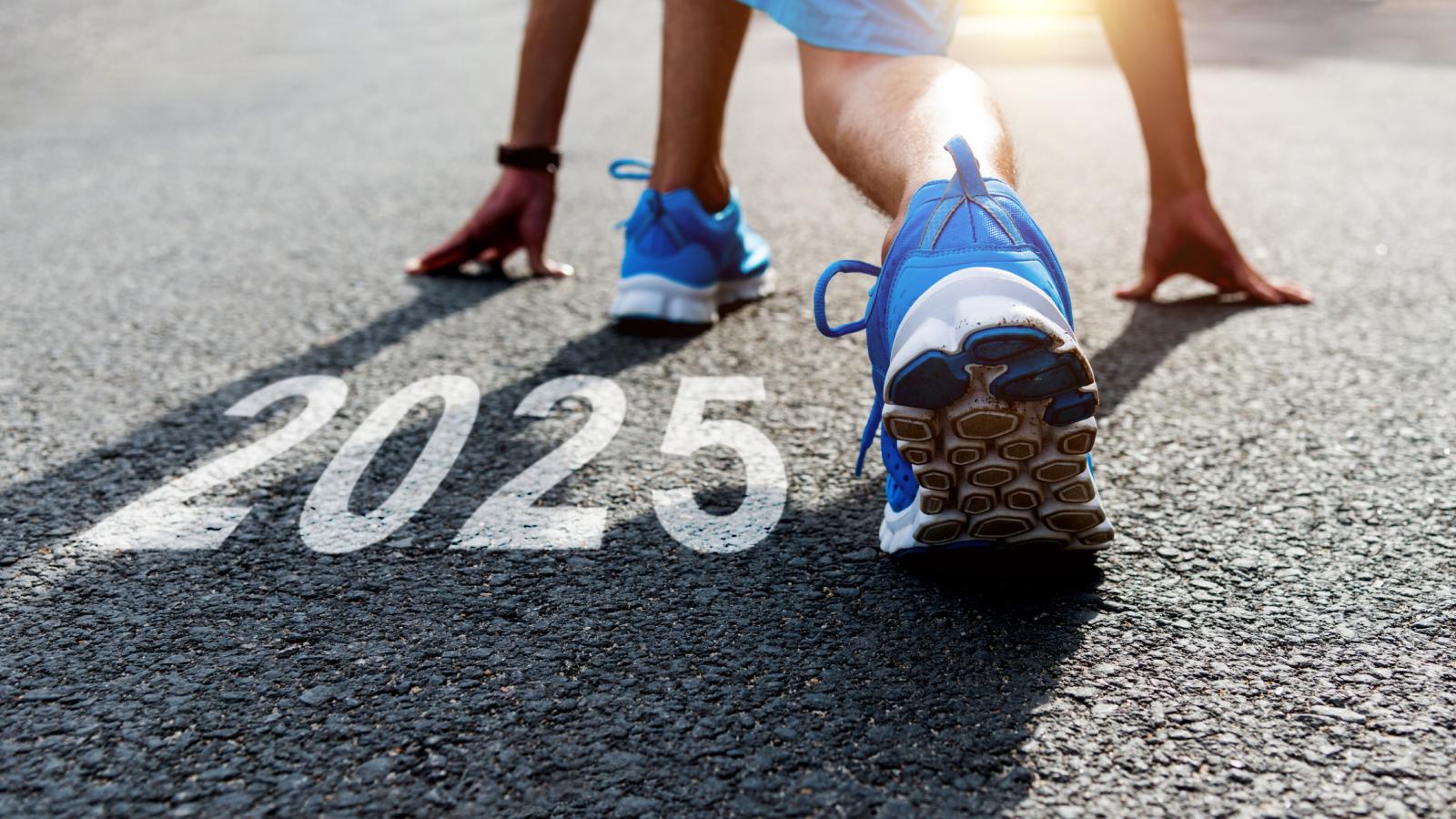 Runner about to start a race with the year 2025 on the ground