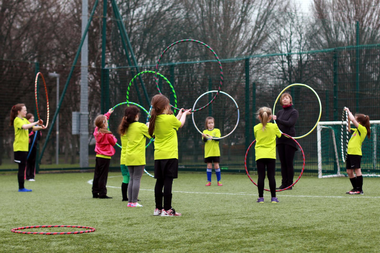 Children playing with Hoola Hoops