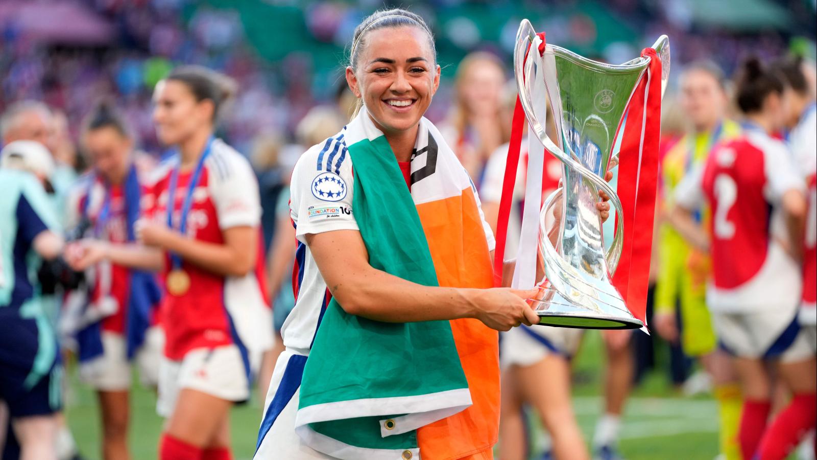 Katie Mc Cabe celebrates with the trophy
